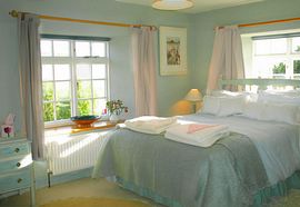 Peaceful bedrooms hung with Rosie's paintings 