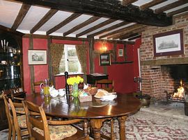 The dining room with the welcoming open fire 