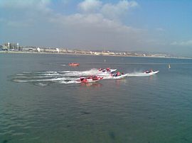 Powerboats race in front of Aaran House 