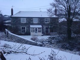 Farm house in the snow 