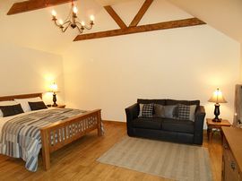 The Cowshed room with high ceilings and oak k 